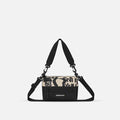 A Sherpani Ciao Shoulder Bag, front view showing lockable pocket and strap options on white backdrop.  #color_ciao-print