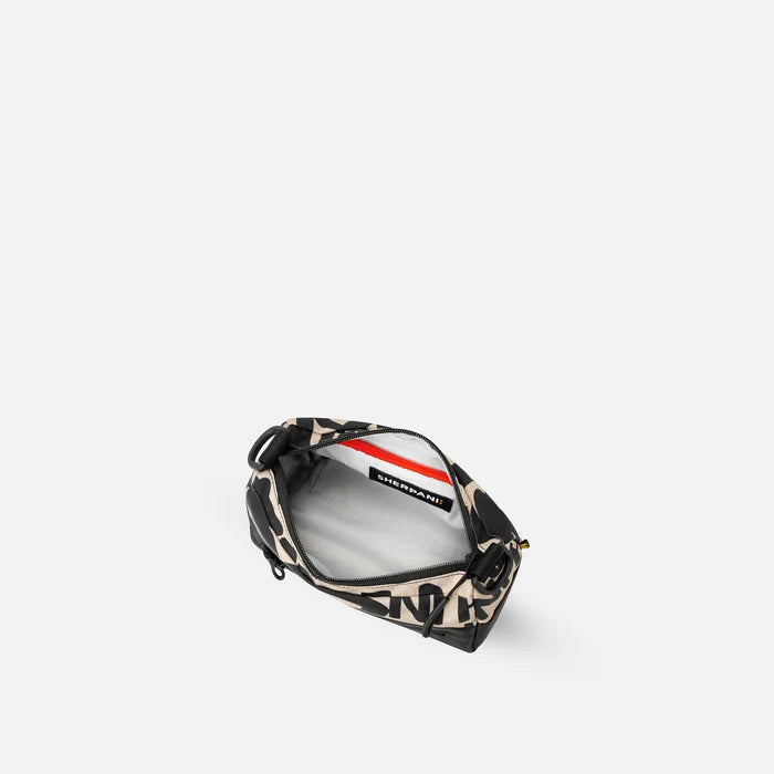 A Sherpani Skye Ciao Shoulder Bag, above view showing inside pockets on a white backdrop. #color_ciao-print