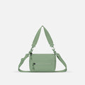 A Sherpani Olivine Shoulder Bag, front view showing lockable pocket and strap options on white backdrop.  #color_olivine-green