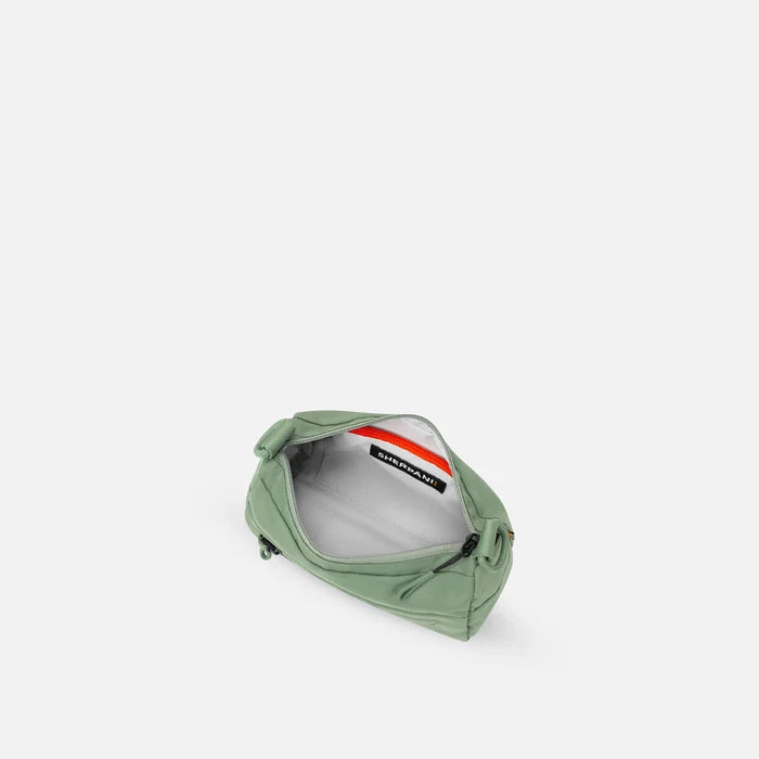 A Sherpani Skye Olivine Shoulder Bag, above view showing inside pockets on a white backdrop. #color_olivine-green