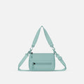 A Sherpani Surf Blue Shoulder Bag, front view showing lockable pocket and strap options on white backdrop.  #color_surf-blue