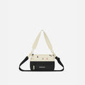 A Sherpani Terrazzo Print Shoulder Bag, front view showing lockable pocket and strap options on white backdrop.  #color_terrazzo-print