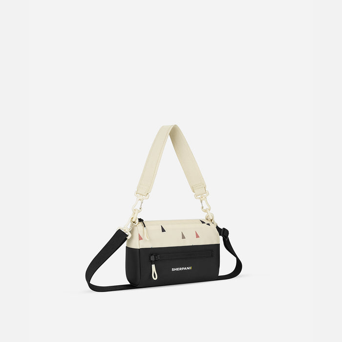 A Sherpani  Terrazzo Print Shoulder Bag, 3/4 view showing lockable pocket and strap options on white backdrop. #color_terrazzo-print