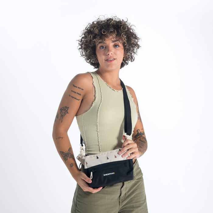 Woman wearing a Sherpani Skye Terrazzo Print Shoulder Bag against white backdrop. #color_terrazzo-print