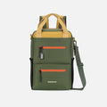 A Sherpani Sojourn Antelope Multi-Wear Pack, front view showing lockable pocket and various straps on white backdrop. #color_antelope