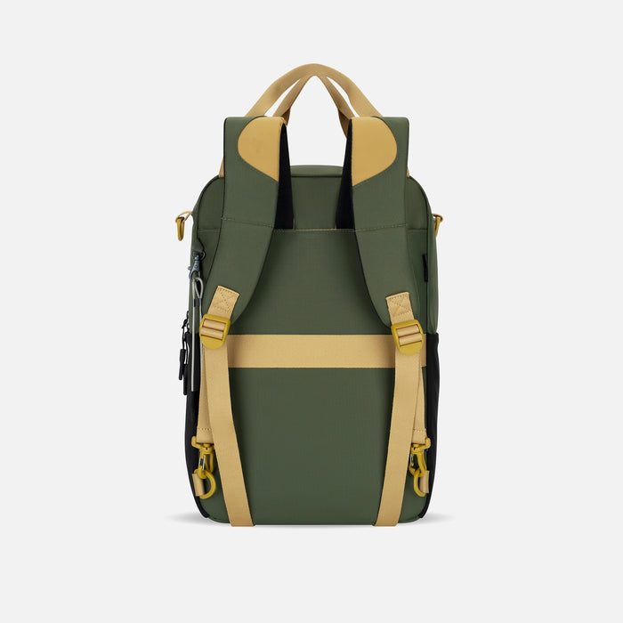 A Sherpani Sojourn Antelope Multi-Wear Pack, back view showing shoulder straps and luggage strap  on white backdrop.  #color_antelope