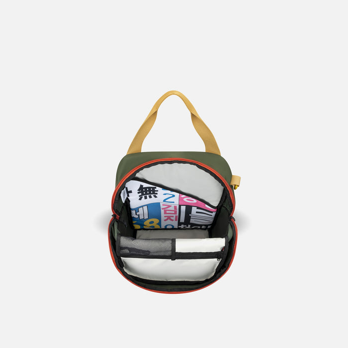 A Sherpani Sojourn Antelope Multi-Wear Pack, above view showing inside main pocket on white backdrop.  #color_antelope