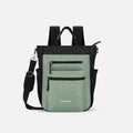 A Sherpani Soleil Aloe Mist Green Anti-theft Multi-Wear Travel Bag, front view showing lockable pockets and straps on white backdrop. #color_aloe-mist-green