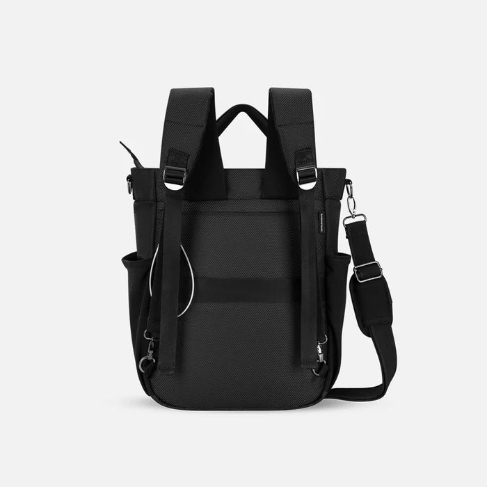 A Sherpani Soleil Carbon Black Anti-theft Multi-Wear Travel Bag, back view showing shoulder and luggage strap on white backdrop. #color_carbon-black
