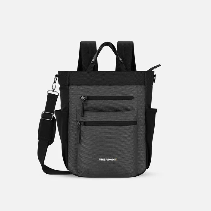 A Sherpani Soleil Granite Anti-theft Multi-Wear Travel Bag, front view showing lockable pockets on white backdrop. #color_granite-grey
