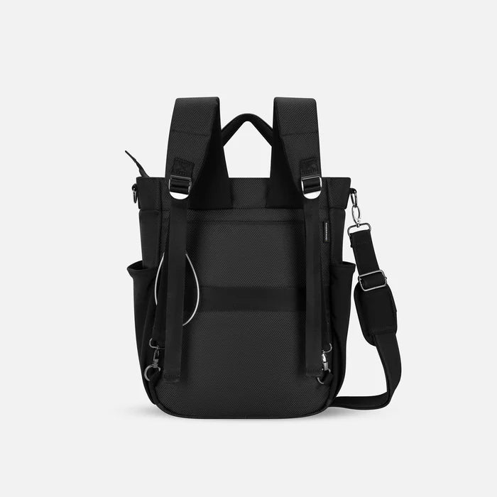 A Sherpani Soleil Granite Anti-theft Multi-Wear Travel Bag, back view showing shoulder and luggage strap on white backdrop. #color_granite-grey