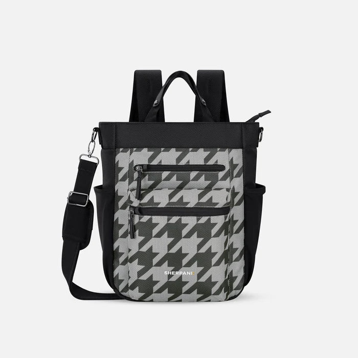 A Sherpani Soleil Houndstooth Anti-theft Multi-Wear Travel Bag, front view showing lockable pockets on white backdrop. #color_houndstooth-print