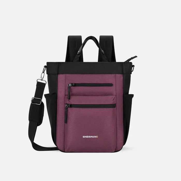 A Sherpani Soleil Smoky Orchid Anti-theft Multi-Wear Travel Bag, front view showing lockable pockets and straps on white backdrop. #color_smoky-orchid-pink