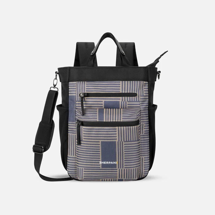 A Sherpani Soleil Passport Anti-theft Multi-Wear Travel Bag, front view showing lockable pockets on white backdrop. #color_passport-print