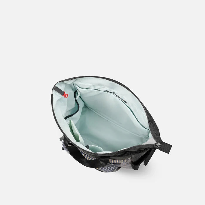 A Sherpani Soleil Passport Anti-theft Multi-Wear Travel Bag, above view showing inside main pocket on white backdrop.  #color_passport-print