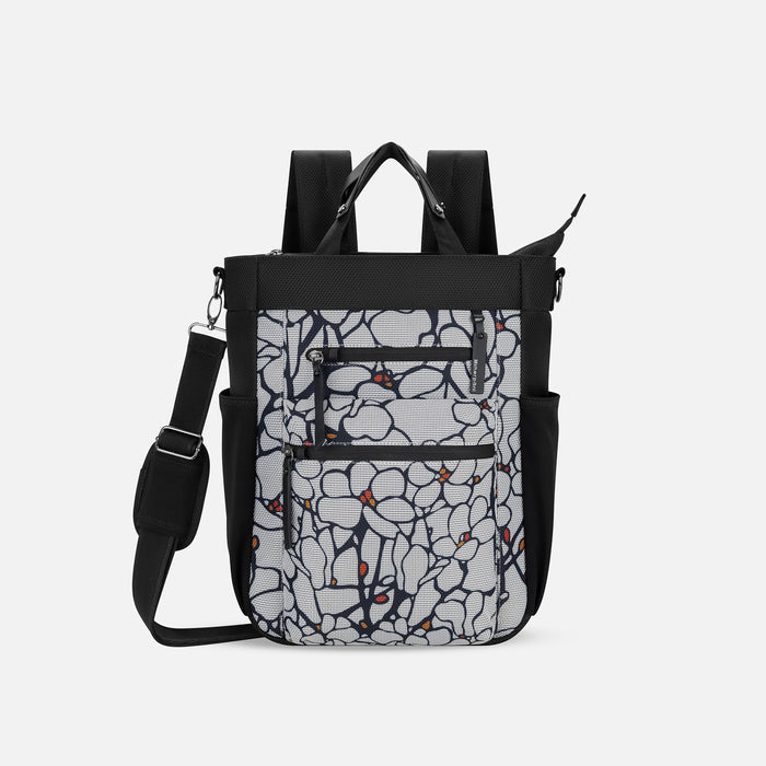 A Sherpani Soleil Sakura Anti-theft Multi-Wear Travel Bag, front view showing lockable pockets on white backdrop. #color_sakura-signature