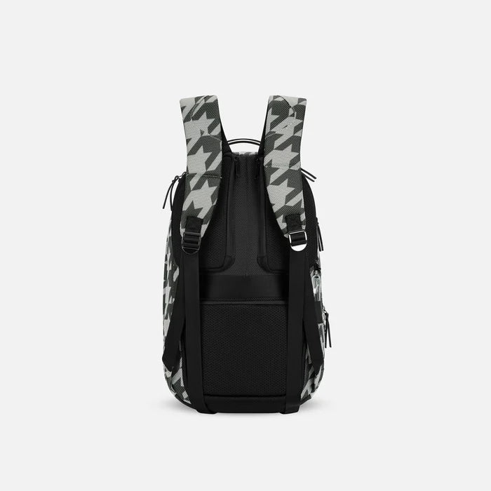 A Sherpani Solstice Houndstooth Anti-Theft Travel Backpack, back view showing back strap pockets and shoulder straps against a white background.   #color_houndstooth-print