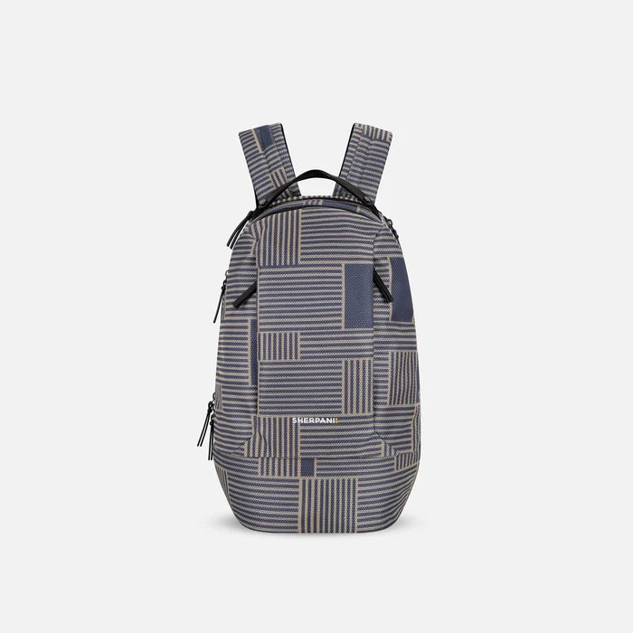 A Sherpani Solstice Passport Anti-Theft Travel Backpack, front view showing front pockets and different straps on white background.  #color_passport-print