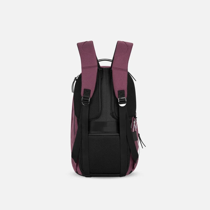 A Sherpani Solstice Smoky Orchid Anti-Theft Travel Backpack, back view showing back strap pockets and shoulder straps against a white background.   #color_smoky-orchid-pink