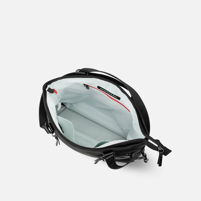 A Sherpani Tempest Carbon Black Convertible Tote, above view showing inside main pocket on white background.  #color_carbon-black