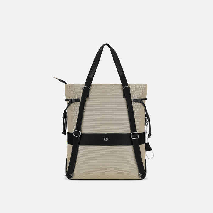 A Sherpani Tempest Straw Beige Convertible Tote, back view showing straps & luggage strap against white background. #color_straw