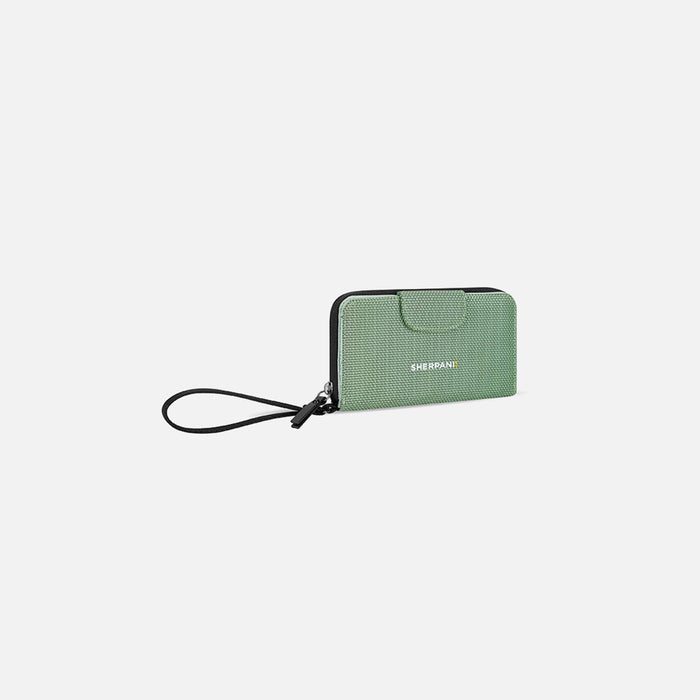 A Sherpani Tulum Aloe Mist Green Anti-theft RFID Wallet, 3/4 view showing wrist strap on white backdrop. #color_aloe-mist-green