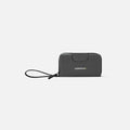 A Sherpani Tulum Granite Anti-Theft Wallet, front view showing wrist strap and clasp on white background. #color_granite-grey