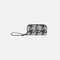 A Sherpani Tulum Houndstooth Anti-Theft Wallet, front view showing wrist strap and clasp on white background. #color_houndstooth-print