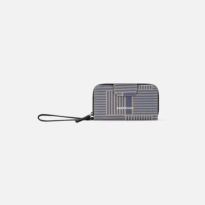 A Sherpani Tulum Passport Anti-Theft Wallet, front view showing wrist strap and clasp on white background. #color_passport-print