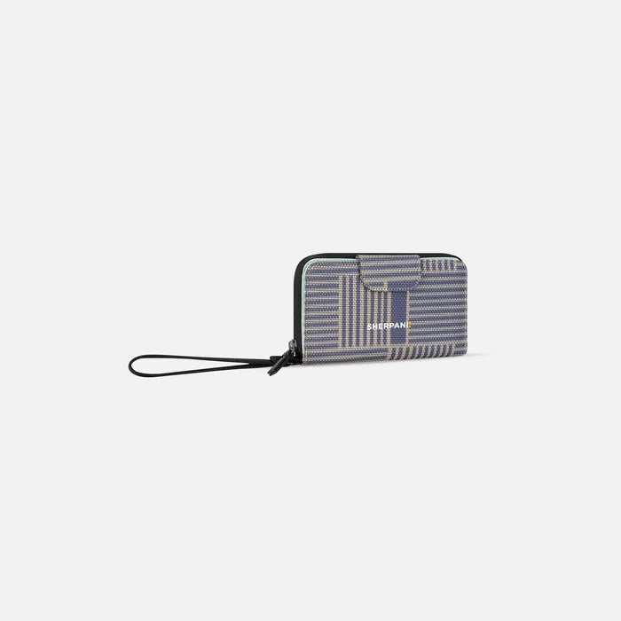 A Sherpani Tulum Passport Anti-Theft Wallet, 3/4 view showing wrist strap and clasp on white background.  #color_passport-print