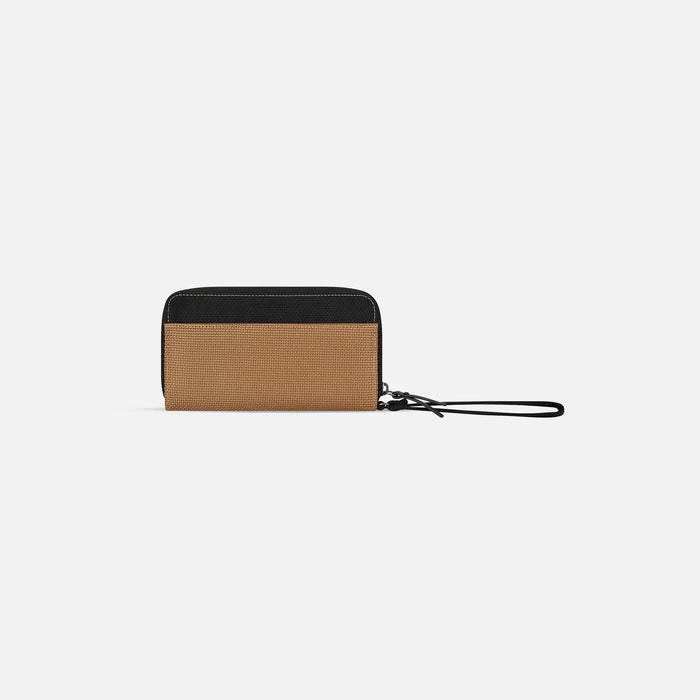 A Sherpani Tulum Sand Anti-Theft Wallet, back view showing wrist strap on white background. #color_sand-tan