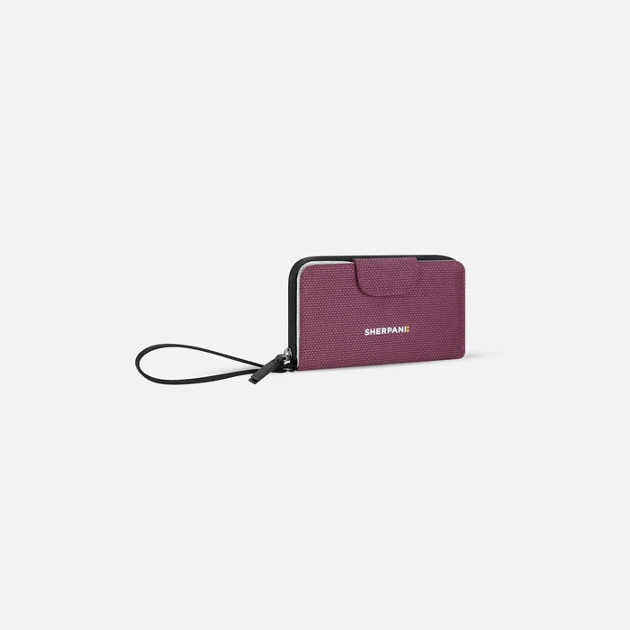 A Sherpani Tulum Smoky Orchid Anti-Theft Wallet, 3/4 view showing wrist strap and clasp on white background.  #color_smoky-orchid-pink