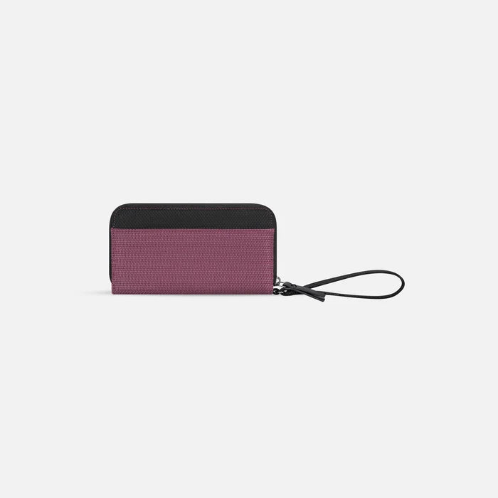 A Sherpani Tulum Smoky Orchid Anti-Theft Wallet, back view showing wrist strap on white background. #color_smoky-orchid-pink