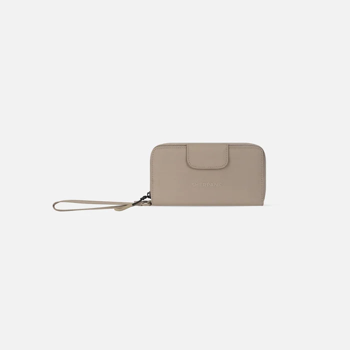 A Sherpani Tulum Dune RFID Wallet, front view showing wrist strap and clasp on white background. #color_dune-tan