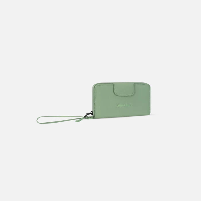 A Sherpani Tulum Olivine RFID Wallet, 3/4 view showing wrist strap and clasp on white background. #color_olivine-green