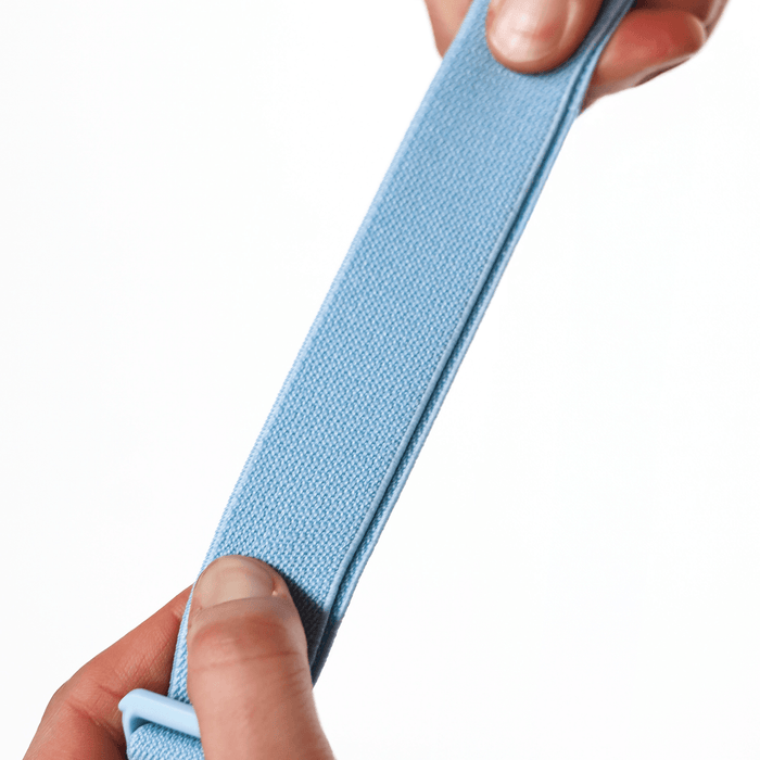 close up of the Sherpani Soft Touch Concealed Waist Wallet Cool Blue stretchy strap on white background.