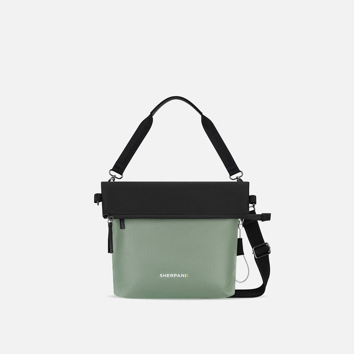 A Sherpani Vale Aloe Mist Green Anti-theft Reversible Crossbody, front view showing folded over front on white background. #color_aloe-mist-green