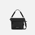 A Sherpani Vale Carbon Black Anti-theft Reversible Crossbody, front view showing folded over front on white background.  #color_carbon-black