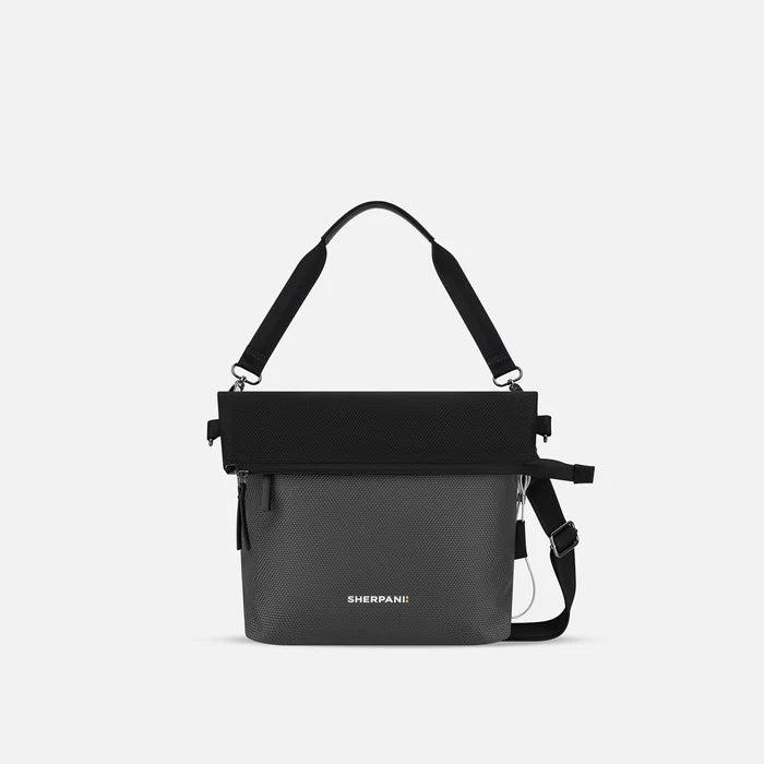 A Sherpani Vale Granite Anti-theft Reversible Crossbody, front view showing folded over front on white background.  #color_granite-grey