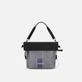 A Sherpani Vale Passport Anti-theft Reversible Crossbody, front view showing folded over front on white background.  #color_passport-print