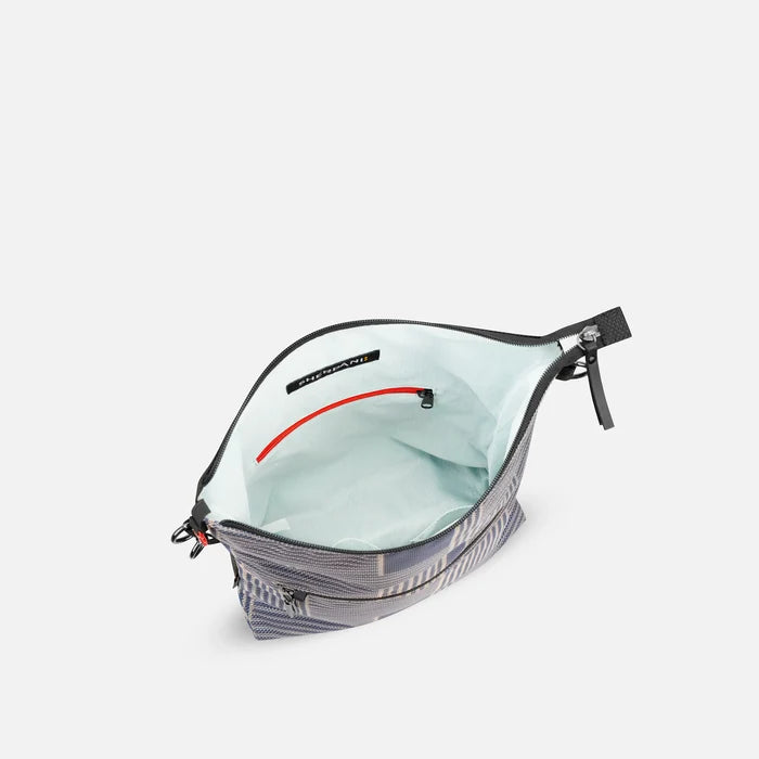 A Sherpani Vale Passport Anti-theft Reversible Crossbody, above view showing inside of main pocket on white background.  #color_passport-print