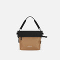 A Sherpani Vale Sand Anti-theft Reversible Crossbody, front view showing folded over front on white background.  #color_sand-tan