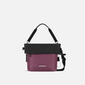 A Sherpani Vale Smoky Orchid Anti-theft Reversible Crossbody, front view showing folded over front white background. #color_smoky-orchid-pink