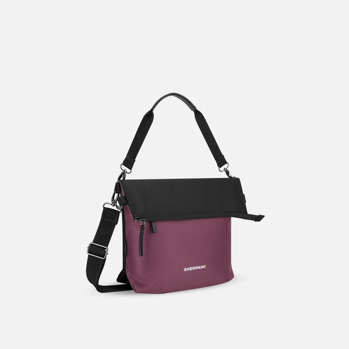 A Sherpani Vale Smoky Orchid Anti-theft Reversible Crossbody, 3/4 view showing folded over front white background.  #color_smoky-orchid-pink