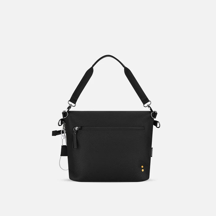 A Sherpani Vale Smoky Orchid Anti-theft Reversible Crossbody, back view showing lockable back pocket white background.   #color_smoky-orchid-pink