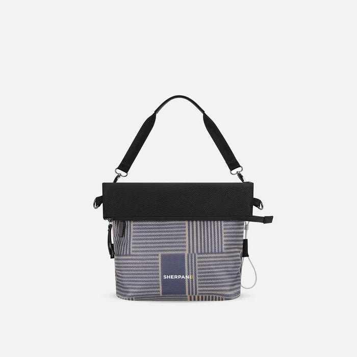 A Sherpani Vale Passport Anti-theft Reversible Crossbody, front view showing folded over front on white background.  #color_passport-print