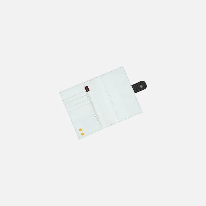 A Sherpani Vienna Carbon Black Anti-theft Passport Wallet, above view showing inside of wallet against white background.  #color_carbon-black