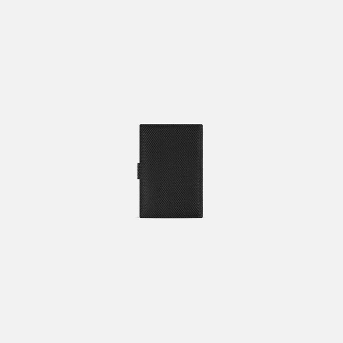 A Sherpani Vienna Carbon Black Anti-theft Passport Wallet, back view against white background. #color_carbon-black