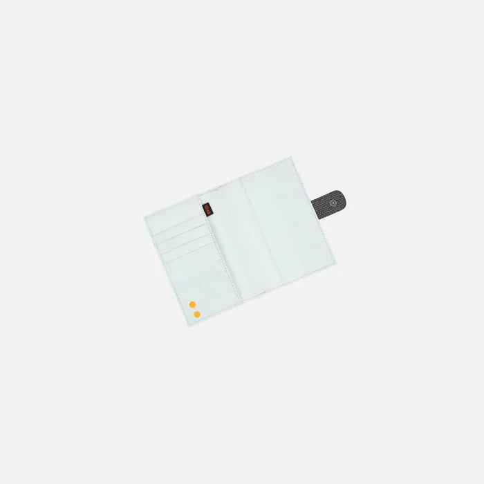 A Sherpani Vienna Granite Anti-theft Passport Wallet, above view showing inside of wallet against white background.  #color_granite-grey