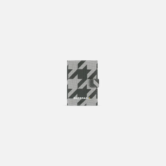 A Sherpani Vienna Houndstooth Anti-theft Passport Wallet, front view against white background. #color_houndstooth-print